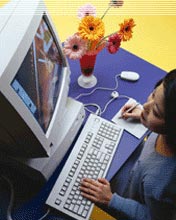 Photo of girl using computer